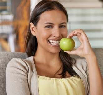 Healthy woman holding apple