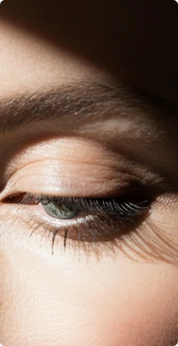 Close-up of a patient's eyes and eyelids showing natural results after eyelid surgery at ICLS Plastic Surgery.